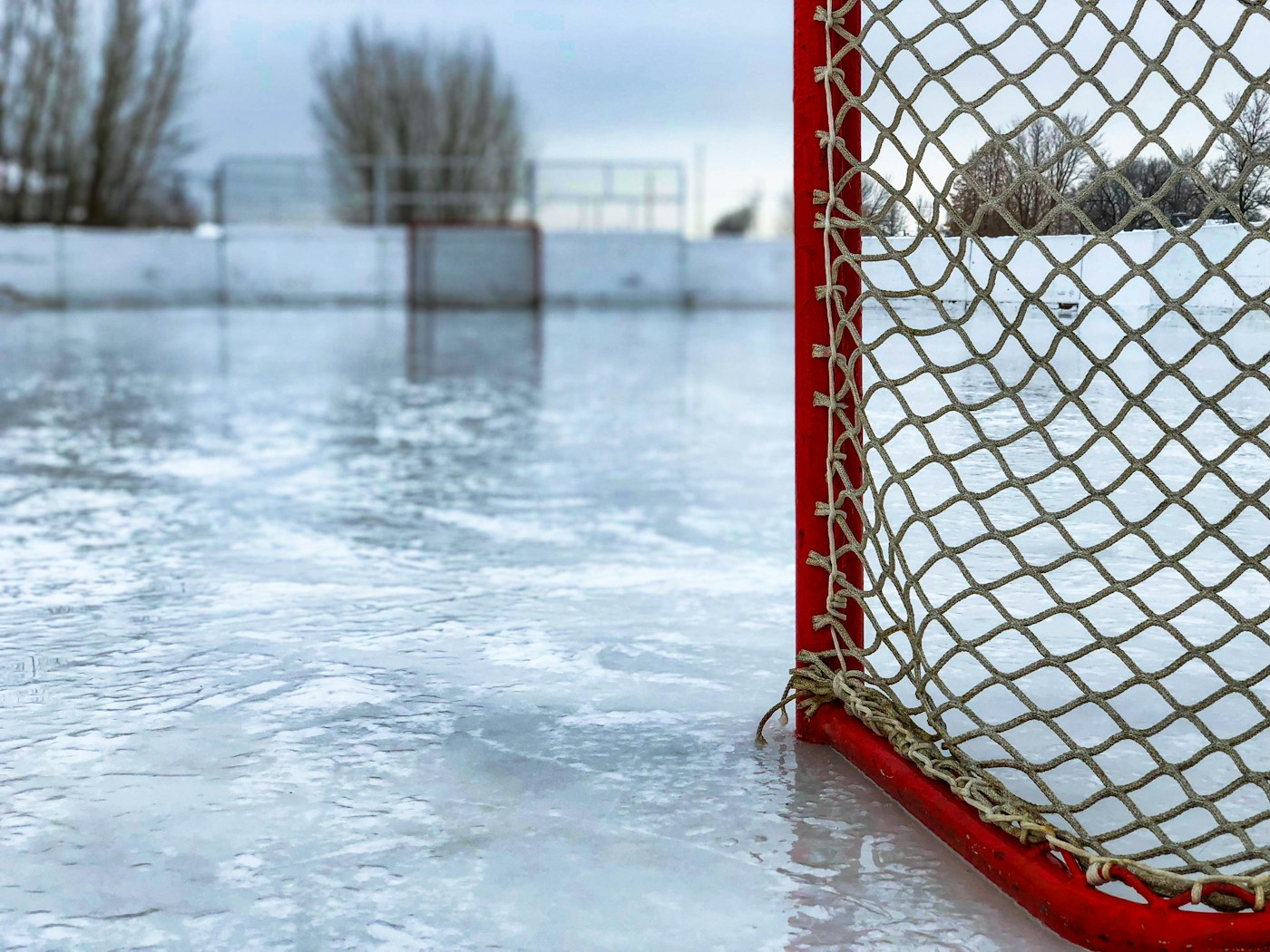 A hockey net on an outdoor rink