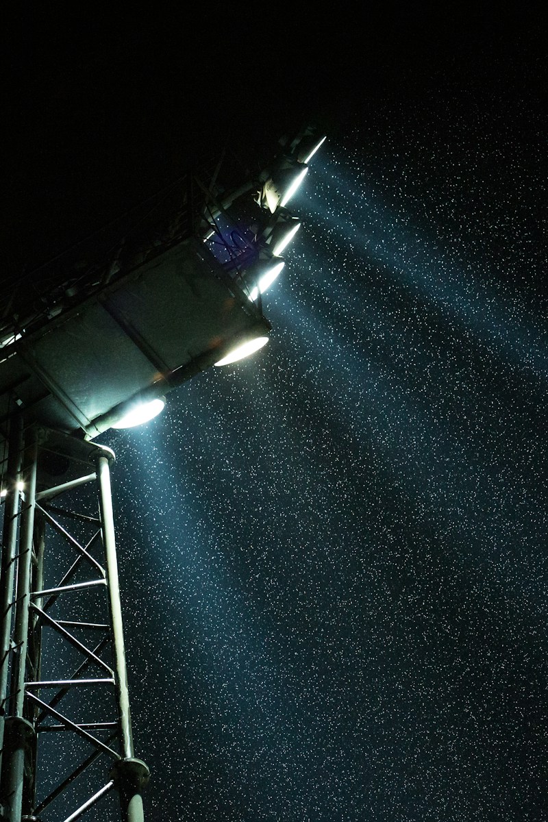Stadium floodlights at night